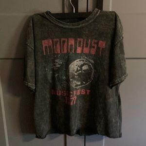 It is a moon shirt that is gray and a bit of pink.